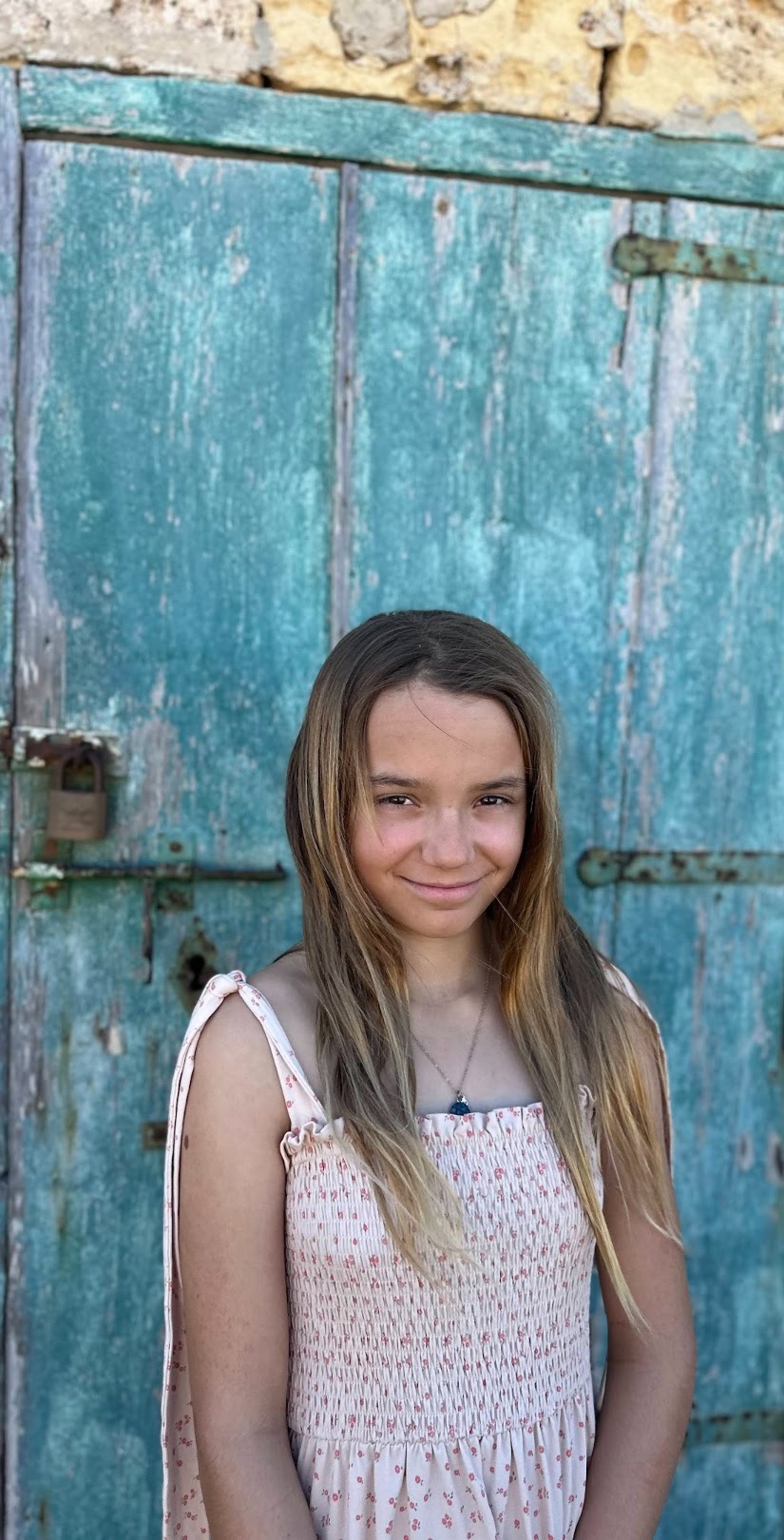 Sage Sedivec in front of a blue door
