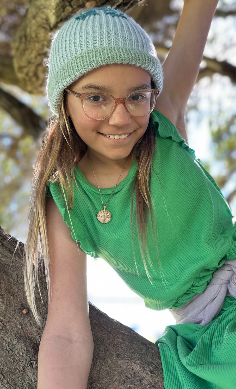 Sage Sedivec climbing a tree